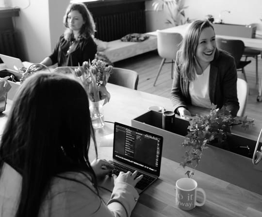 A picture of women working at an office.